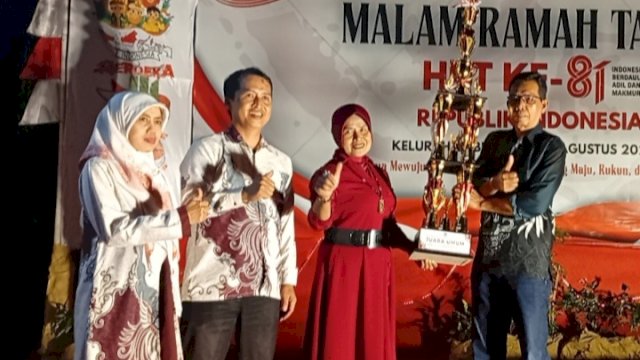 Sekretaris Camat (Sekcam) Tamalanrea, Nur Alam A, S.E., M.M., menghadiri Malam Pesta Rakyat tingkat Kelurahan Buntusu yang digelar di Lapangan Tala Limampuloa, BTP, Senin (24/8/2026).